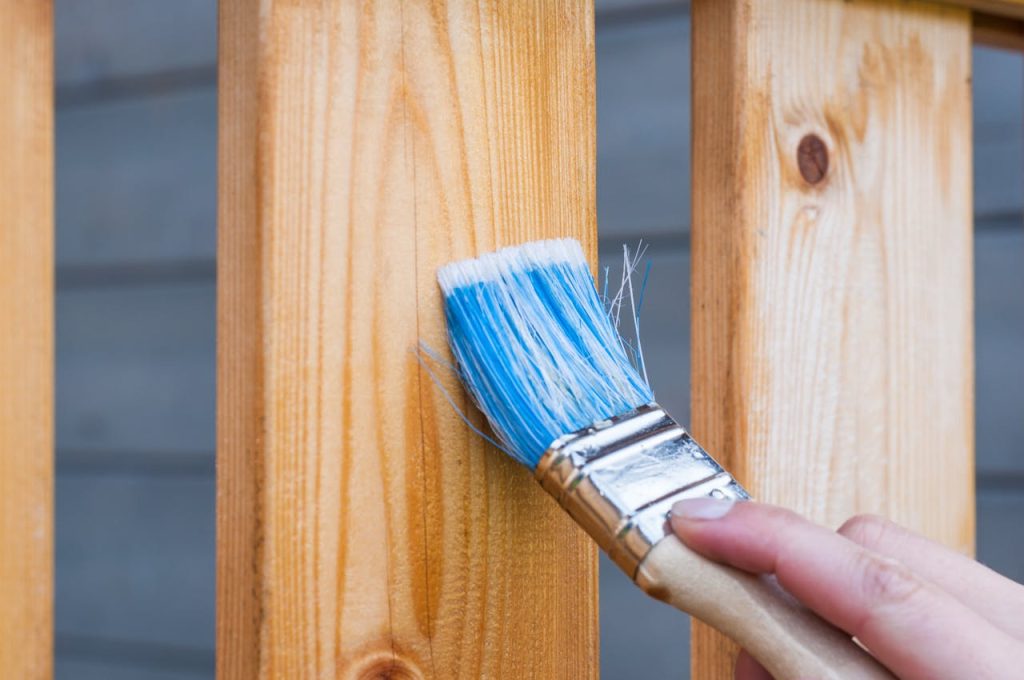 A person holding a paintbrush.
