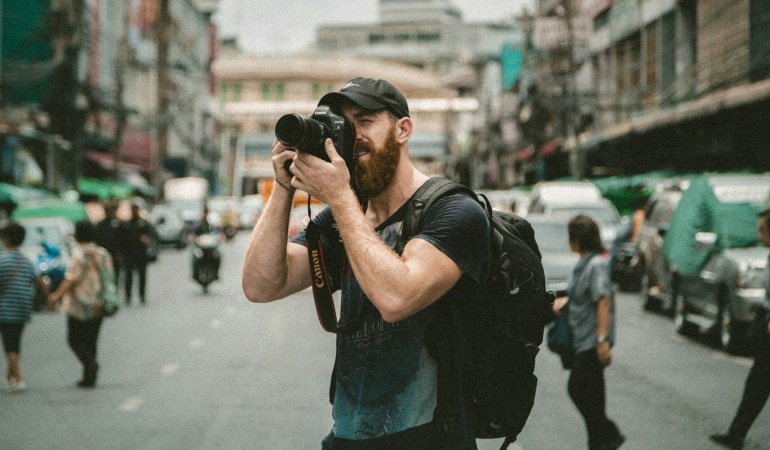 Man taking photos with a camera.